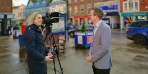 Graham Soult being interviewed in Morpeth Market Place by ITV's Katie Cole